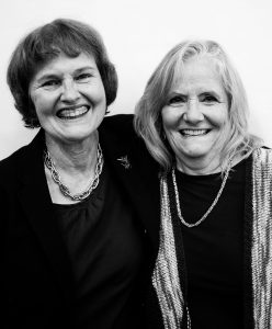 two women hugging and smiling