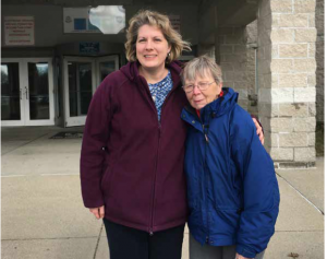 Trish and Edna standing in front of the prison